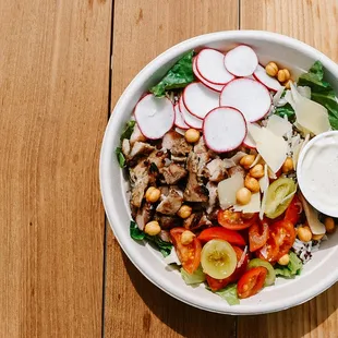 a bowl of salad with dressing