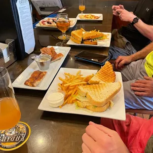 Group meal: 2x Chicken Bacon Avocado Sandwich, beer Pretzel Bread and Dip, House Made Dessert Pizza, and then brunch pizza