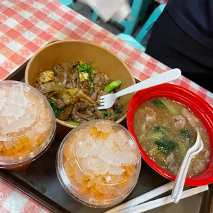 three bowls of food on a tray