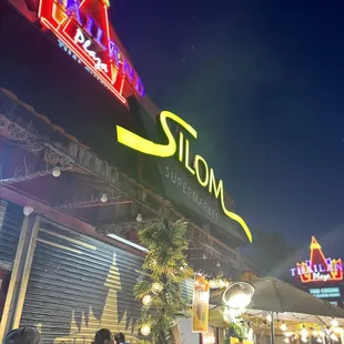 Silom market outdoor sign and seating