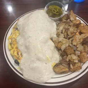 The ultimate omelette with jalapeños on the sod  Ed and home fried potatoes and onions. Absolutely delicious!!
