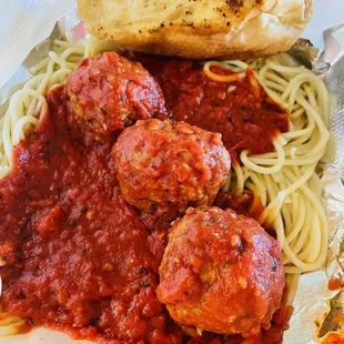 Spaghetti and meatballs with garlic bread dinner take out