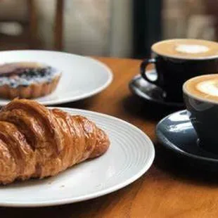 Share a cup of coffee and pastry with your friend