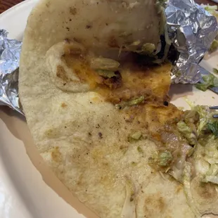 Empty tortilla , not enough beans just a few In the center and cheese had bad flavor , is sad I used to love how thick they used to be