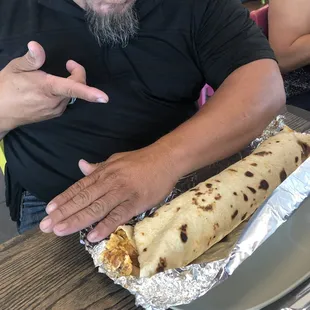 Burrito as long as his arm!!