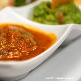 a bowl of salsa and a bowl of guacamole