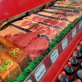 a display of meat and drinks