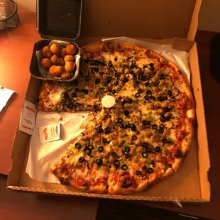 a whole pizza in a box