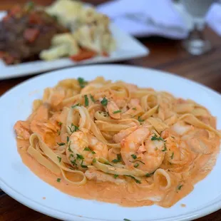 a plate of pasta with shrimp