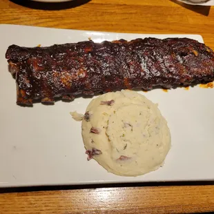 Hickory-smoked baby back ribs with garlic mashed potatoes
