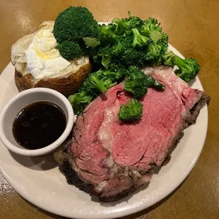Prime rib rare baked potato and broccoli