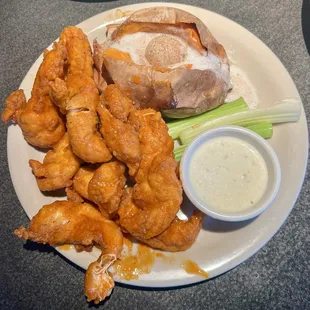 Chicken tender platter with a loaded sweet potato