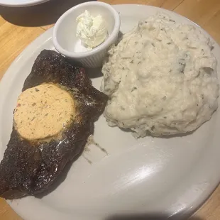 Cowboy sirloin with cajun butter and garlic mashed potatoes