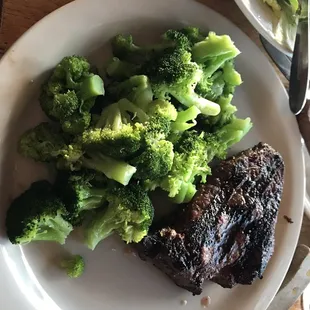 Cowboy steak medium with a side of steamed broccoli