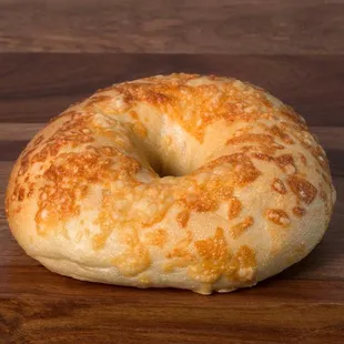 Freshly baked bagel topped with asiago cheese.