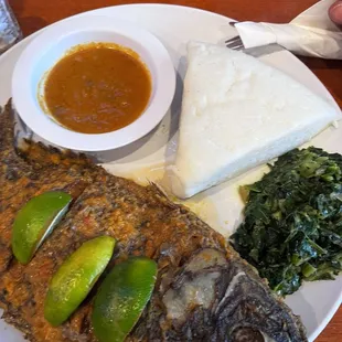 Ugali, samaki and sukumawiki ( cornbread, tilapia and collard greens)