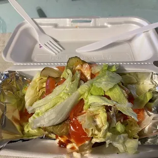 Bunless cheeseburger with extra patty, grilled onions, lettuce, tomato, pickles, ketchup and mayo.