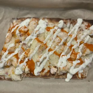 Very tasty Buffalo chicken flatbread with ranch. The crust was perfectly crisp. The chicken was perfectly cooked as well.