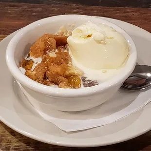 The peach cobbler with vanilla ice cream.
