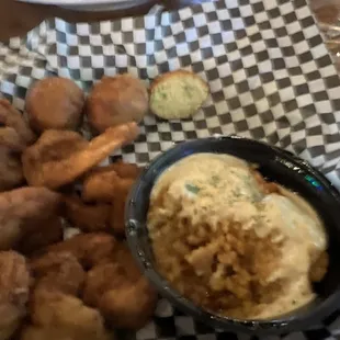 This is my dinner fried shrimp , hush puppies n grits   Was unviable the flavor