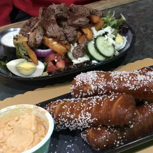 Pretzels with beer cheese and steak salad