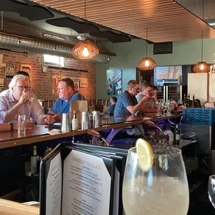 people sitting at a bar