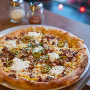 a pizza on a plate on a table