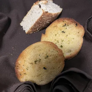 Garlic bread and soft focaccia bread at the table