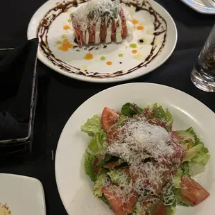a plate of salad and a glass of water