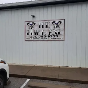 a white truck parked in front of a building