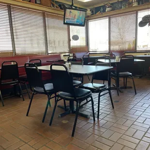 a restaurant with tables and chairs