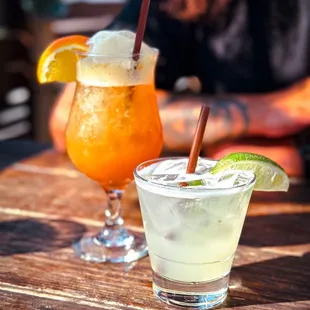 two cocktails on a table