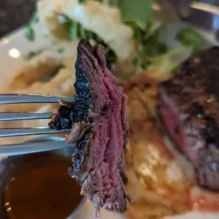 Serious Steak, 10 oz sirloin, mashed potatoes, battered onion rings and whiskey peppercorn sauce
