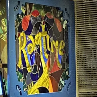 a stained glass window with the word ragtime