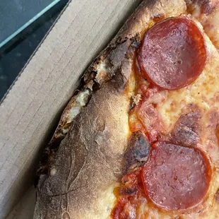 a pepperoni pizza in a box