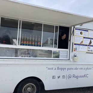 a woman ordering food from a food truck