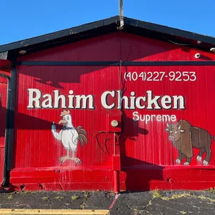 a red building with a sign that says rahim chicken supreme