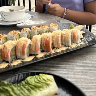 Rai Lay specialty roll and California roll with miso soup in the background