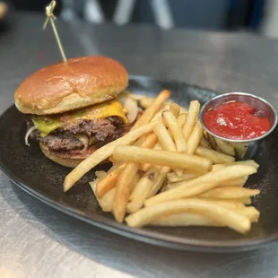 a hamburger and fries on a plate