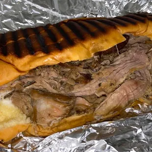 Pernil (slow roasted pork) and cheese sandwich.