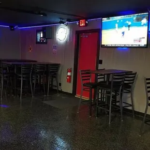 bar seating and televisions