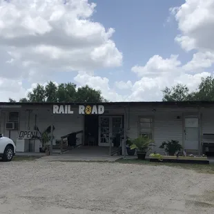 a white car parked in front of the building