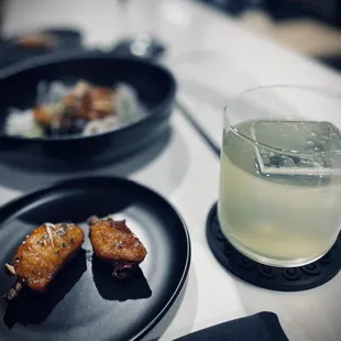 two plates of food and a glass of lemonade