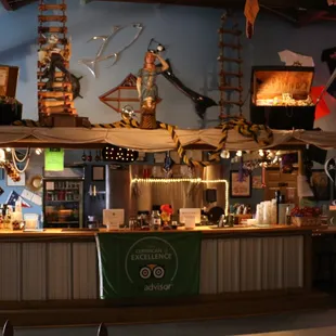 a bar with a flag hanging from the ceiling