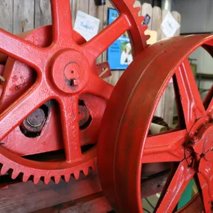 a large red wheel on a shelf