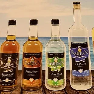 a row of bottles of different flavors