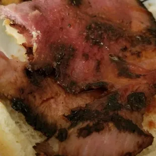 a piece of meat on a bun