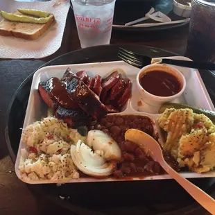 Ribs, Sausage, beans, coleslaw, potato salad. What are you eating?