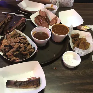 Brisket, ribs, jalapeno cheddar sausage, cheddar peppers, beans, and bbq sauce.