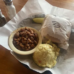 Chop brisket, sandwich, pinto beans, and potato salad